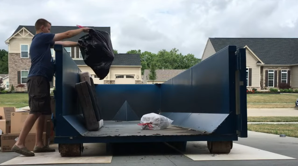 Desert Valley Dumpster Rentals roll-off container loaded with heavy construction and excavation debris in Las Cruces, NM